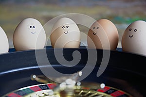 Group of happy eggs friends  make bets gambiling at the toy roulette in the toy casino