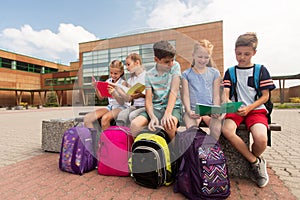 Group of happy elementary school students outdoors