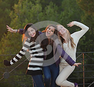 Group of happy friendly fashion teens