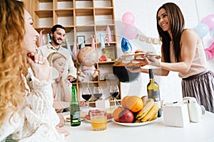 Group of happy friends celebrating baby shower