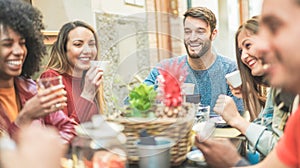 Group of happy friends drinking coffee and cappuccino at vintage bar outdoor - Young millennials people doing breakfast together