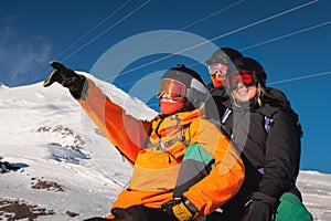 group of happy friends are having fun. Snowboarders and skiers group, friendship, team. ski resort