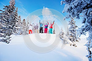Group happy friends man snd woman snowboarders and skiers having crazy fun ski resort winter forest