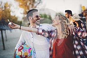 Group of happy friends partying on beach