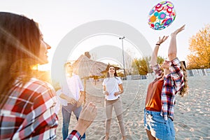 Group of happy friends partying on beach