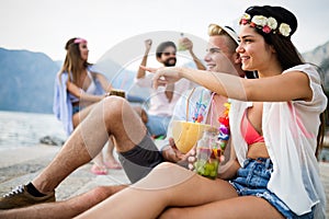 Group of happy friends partying and having fun on summer vacation