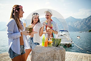 Group of happy friends partying and having fun on summer vacation