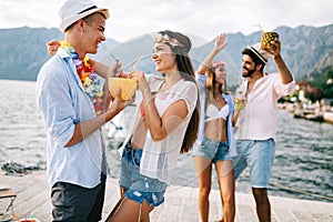 Group of happy friends partying and having fun on summer vacation