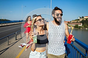 Group of happy friends people having fun together outdoors