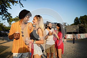 Group of happy friends people having fun together outdoors