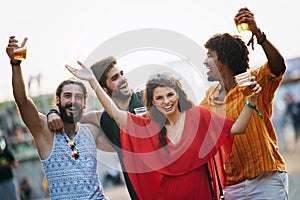 Group of happy friends people having fun together outdoors