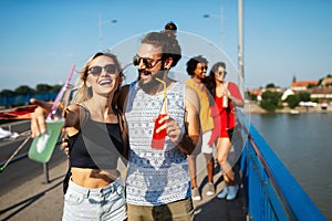 Group of happy friends people having fun together outdoors