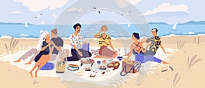 Group of happy friends at picnic on seashore. Young smiling men and women eating food on sandy beach. Cute funny people