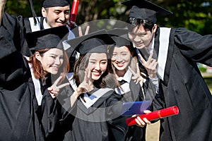 Group happy graduates students