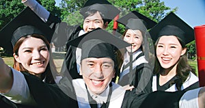 Group happy graduates students