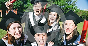 Group happy graduates students