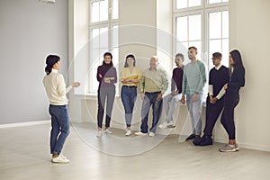 Group of happy interested diverse people listening to a lifestyle or business coach