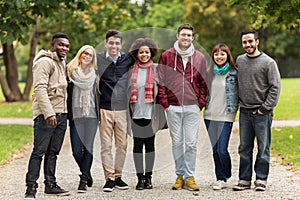 Group of happy international friends at park