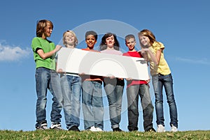 Group of happy kids,blank sign