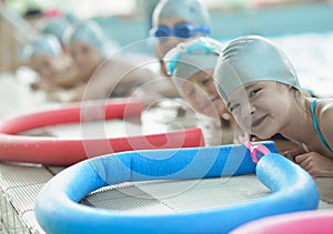 Group of happy kids children at swimming pool