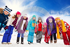 Group of happy kids outside on snow day