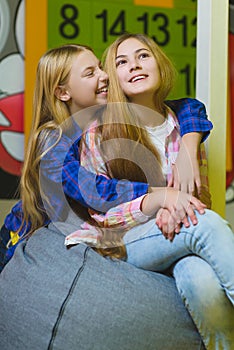 Group of happy kids playing in children room