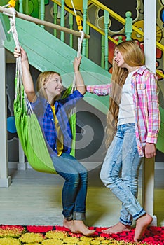 Group of happy kids playing in children room