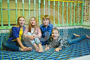 Group of happy kids playing in children room