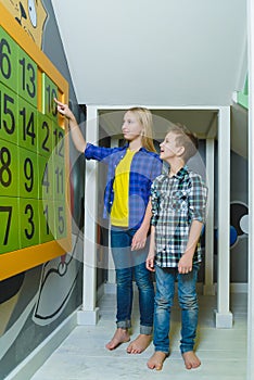 Group of happy kids playing in children room