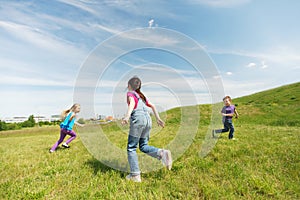 Group of happy kids running outdoors