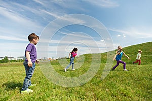 Group of happy kids running outdoors