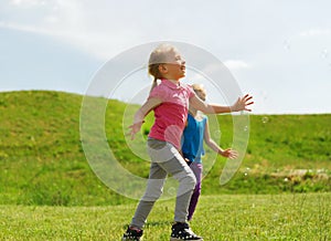 Group of happy kids running outdoors