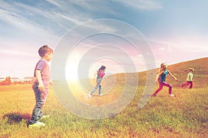 Group of happy kids running outdoors