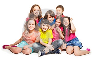 Group of happy kids sitting together
