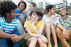 Group of happy latin, caucasian and african american young adults