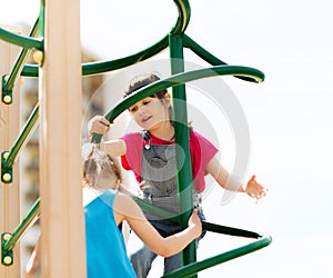 Group of happy little girls on children playground