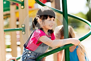 Group of happy little girls on children playground