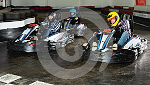 Group of happy male and females driving cars