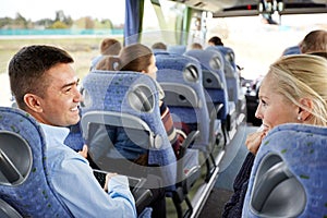 Group of happy passengers in travel bus