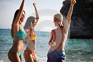 Group of happy people having fun at summer. Beach vacation friends travel concept