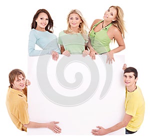 Group of happy people holding banner.