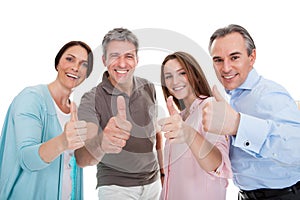 Group of happy people showing thumb up sign