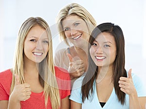 Group Of Happy And Positive Businesswomen In Casual Dress Making Thumbs Up Gesture