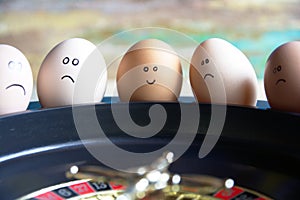 Group of happy and sad eggs friends  make bets gambiling at the toy roulette in the toy casino