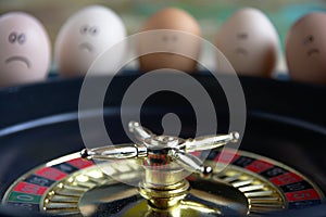 Group of happy and sad eggs friends  make bets gambiling at the toy roulette in the toy casino. Roulette in focus