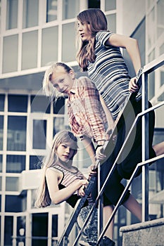 Group of happy school girls on steps