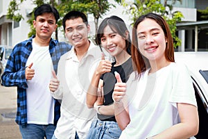 Group of happy smiling Asian teenagers having fun Travel by car.