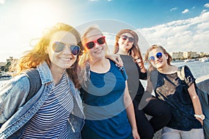 Group of happy smiling carefree young stylish girl female friend