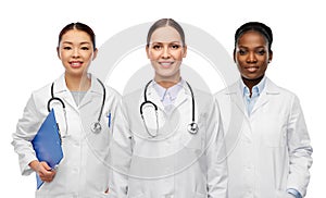 group of happy smiling female doctors or nurses