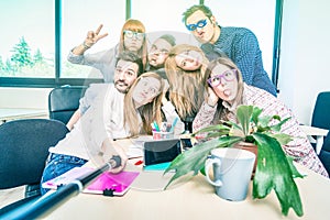 Group of happy students employee workers taking selfie